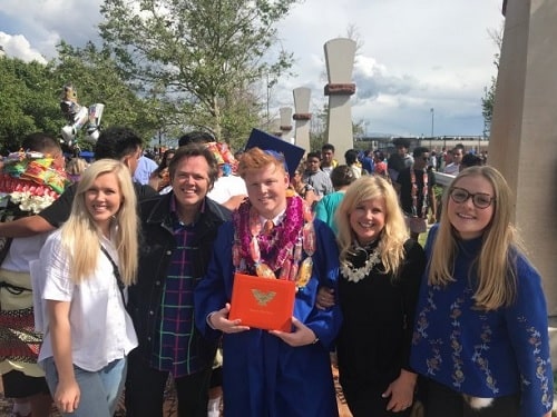 A picture of Arthur Wyatt Osmond with his parents and sisters.